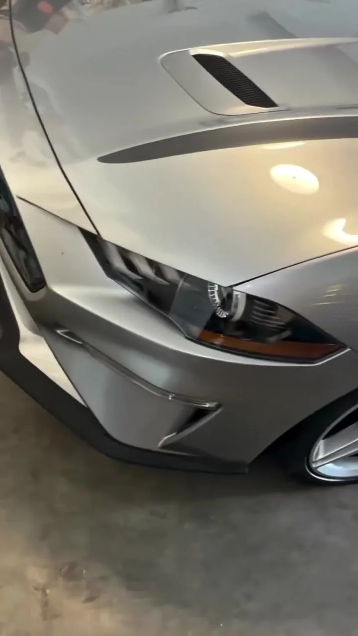 Mustang hood with reflective, corrected paint after machine polishing